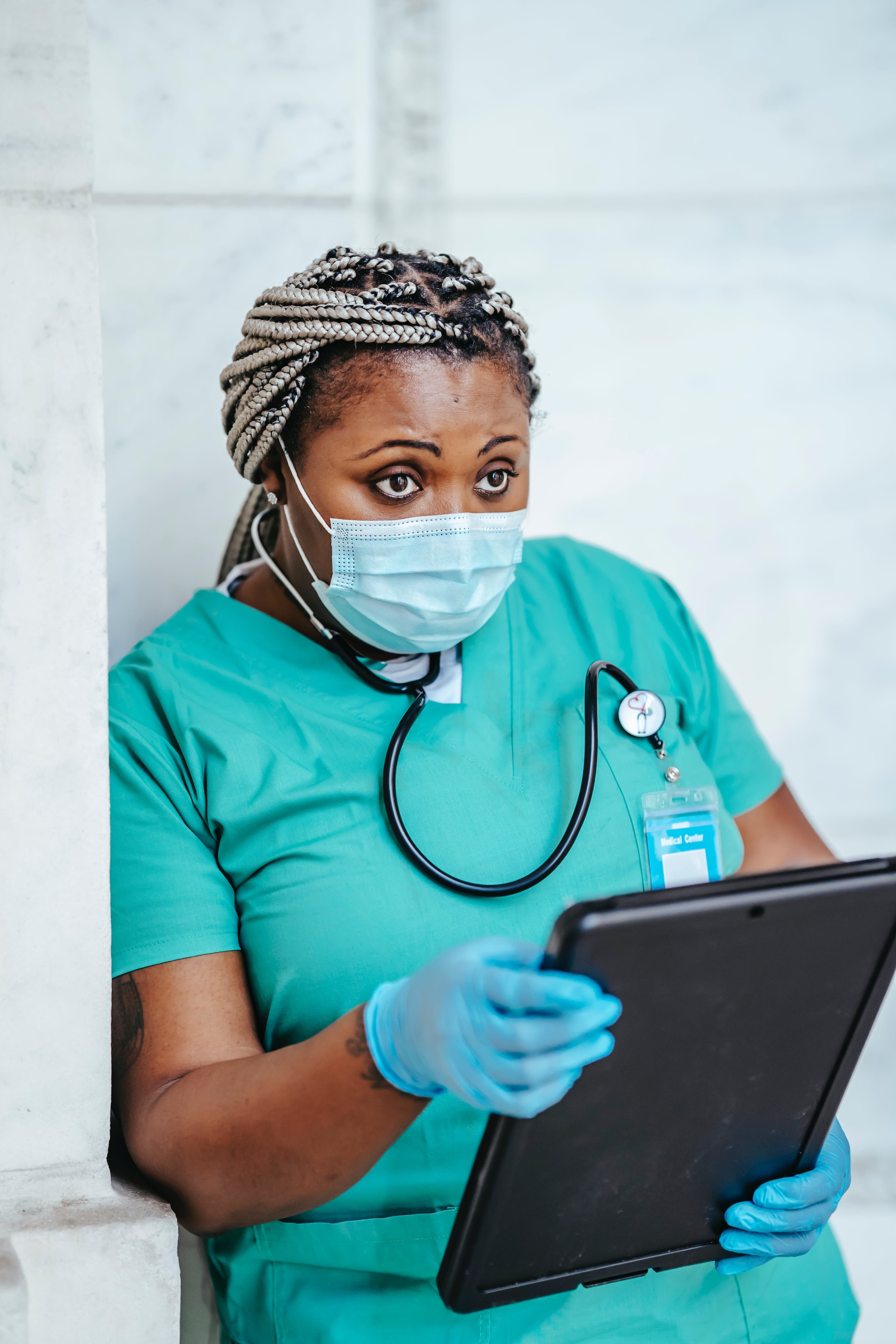 Professional healthcare worker reviewing care plans